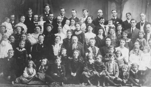 Joseph F. Smith (center), an early leader of the Church of Jesus Christ of Latter-Day Saints, is shown in 1904 with his polygamous family, including his sons and daughters, their spouses and children. (Wikimedia Commons)