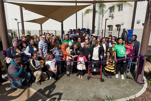 Residents cut the ribbon on Golden Age Park in Los Angeles in November. The park was built in part with funds from the AARP Community Challenge grant program. (Nacho Mora)