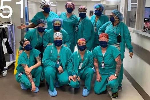 A group of nurses and other health care workers show off protective masks made for them by Arizona volunteers. (Mask-Making-4-AZ)