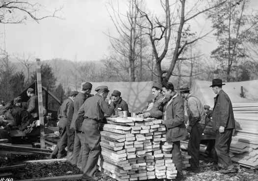 CCC members having a meal at camp. (Lewis Hine, U.S. National Archives and Records Administration, Public Domain)
