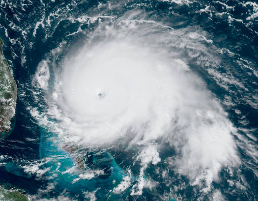 Hurricane Dorian made it to Category 5 and parked above the Bahamas, flattening structures and leaving some 70,000 people homeless. (wikipedia)