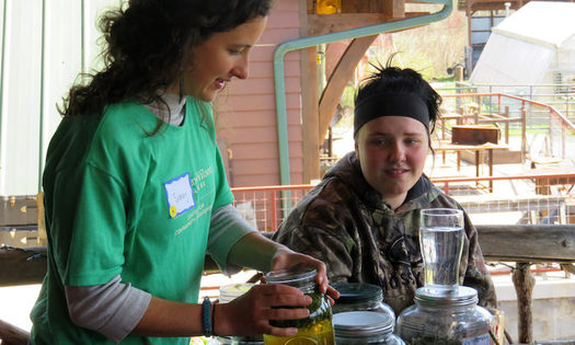 A Warren Wilson College student teaches herbal tea making to local high schoolers the year before the coronavirus pandemic. (Mallory McDuff)
