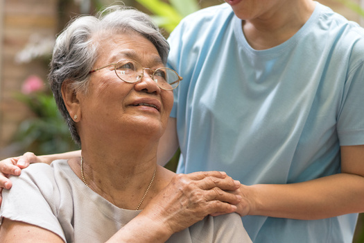 Family caregivers spend nearly 24 hours a week on average providing care, according to AARP. (Khunatorn/Adobe Stock)