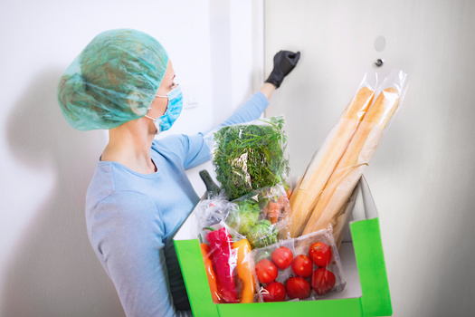 Food banks are critical community resources for families dealing with job losses during the pandemic. (astrosystem/Adobe Stock)