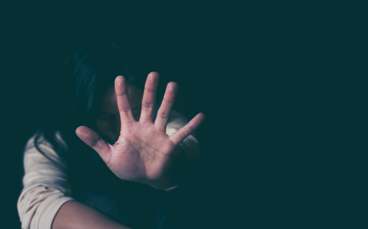 Mistrust of police is cited as one of the main reasons why women of color who are victims of domestic violence don't seek help from mainstream assistance groups. (Adobe Stock)