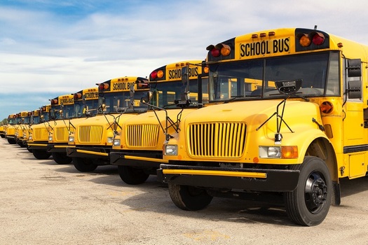 School bus drivers say it's difficult for them to prevent close contact between themselves and their students on their daily routes. (pyzata/Adobe Stock)