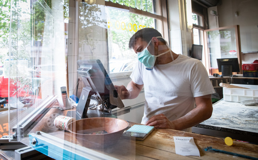 Wisconsin and more than 30 other states now require face masks in most public settings amid a resurgence of the coronavirus. (Adobe Stock)