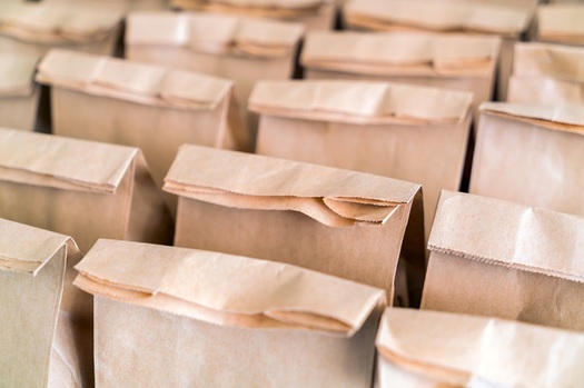 Most Arizona schools are reopening with students at home taking online classes, but districts still are required to provide free or reduced-cost meals for pickup by students who qualify for them. (Jannoon028/Adobe Stock)