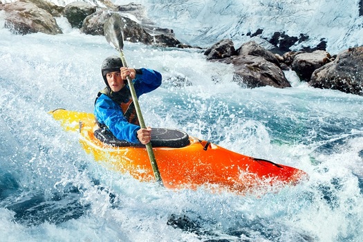 Whitewater kayaking is one of dozens of activities outdoor enthusiasts participate in on public lands in states in the Mountain West. (VAIR PRO/Adobe Stock)