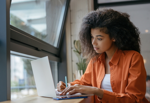 A new survey shows Black and Latino students in Virginia are twice as likely as white students not to have a computer in the home. (Adobe stock)