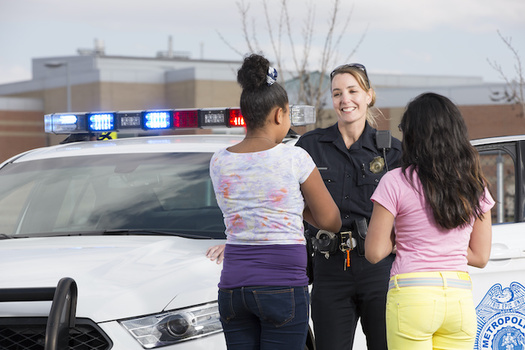 Research shows allowing police officers to handle minor infractions in schools often marks a student's first contact with the criminal justice system, potentially setting them up for a lifetime of collateral consequences. (Adobe Stock)
