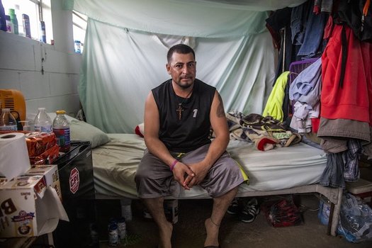 Jos Indalecio, a tractor operator, sits in his living quarters at a Johnston County farmworker camp on Aug. 27. The camp does not have air conditioning, which is considered a luxury by many farmworkers in North Carolina. (Travis Long, TLONG@NEWSOBSERVER.COM)