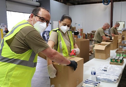 Demand for food assistance in Nebraska has spiked during COVID-19, with Omaha's Together drive-through food pantry serving some 250 cars daily. (Wikimedia Commons)