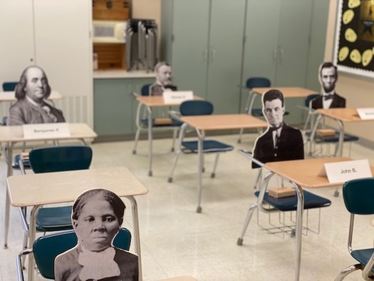Filling empty chairs with cutouts of historical figures makes social distancing a learning tool. (Photo: Joe Welch)  