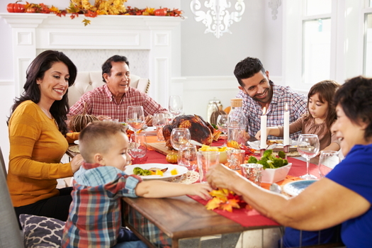 Experts advise using compassion if the conversation veers into difficult political topics around this year's holiday dinner table. (Adobe Stock)
