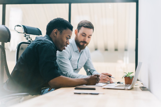 Good communication skills can boost a person's wages up to 20%, according to a new report. (BullRun/Adobe Stock)
