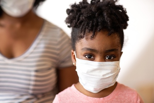 A report says disparities in health coverage have fueled the disproportionate impact of the pandemic on Black and Brown communities. (AdobeStock)