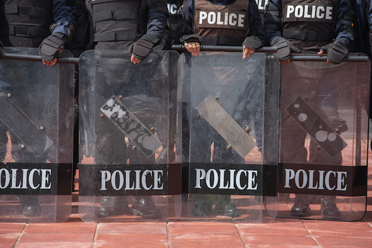 Civil-rights advocates point out that police regularly confront social-justice demonstrations with militarized force. (saksuvan/Adobe Stock)