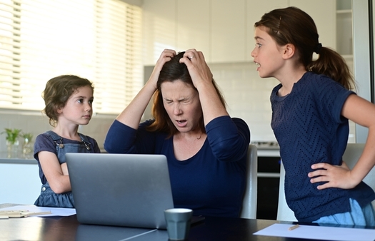 Experts are concerned that many parents haven't been equipped in the pandemic to cope with the stress of working at home while their children are learning from home. (Rafael Ben-Ari/Adobe Stock)