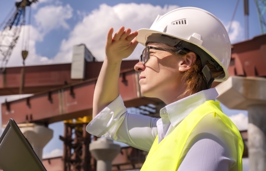 Under President Joe Biden's infrastructure program, thousands of new workers would be needed to improve bridges and roadways, repair water and wastewater systems and build a clean-energy economy. (denklim/Adobe Stock)