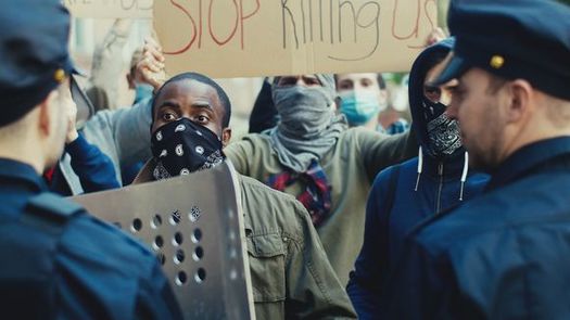 Racial-justice protests reached a global scale last year, but in some states and cities, how police respond to demonstrators remains a thorny issue. (Adobe Stock)