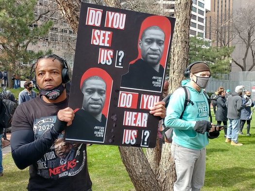 Activist Willie Austin stands outside the Hennepin County Courthouse before the verdict is read in the Derek Chauvin trial. (Public News Service/Mike Moen)