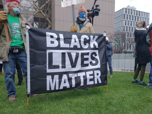 Activists await the Derek Chauvin verdict outside the Hennepin County Government Center. (Public News Service/Mike Moen)