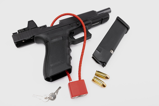 The Gun Safety Consortium says many gun owners fear gun locks will prevent their being able to access their firearms quickly.  (Atlantist studio/Adobe Stock)