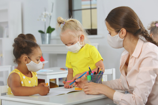 The pandemic has put added stress on the child-care workforce across the country. In Washington state, it caught the attention of legislators, who've included more money for pay and health benefits in the new state budget. (ShunTerra/Adobe Stock)