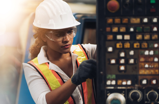 Raising women's hourly wages to match those of Wyoming men would add $153 million in labor income in a single year, a report says. (Adobe Stock)
