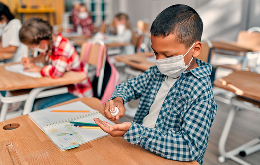 In addition to recommending teachers, students and school staff member mask up indoors this fall, new CDC guidelines recommend even vaccinated people wear masks in areas with high COVID case numbers. (Vasyl/Adobe Stock)