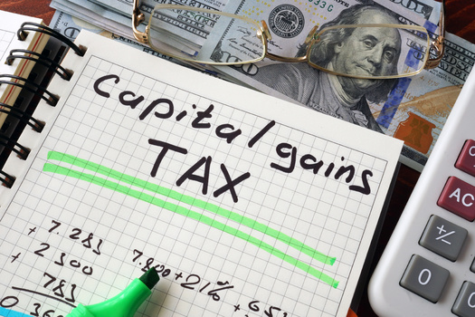 In a new poll, 64% of New Hampshire voters said they think capital gains should be taxed at the same rate as income from wages; 56% support increasing the corporate tax rate to 28%. (Vitalii Vodolazskyi/Adobe Stock)