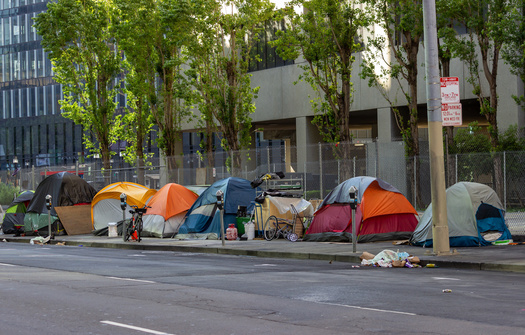 Initiated Ordinance 303 calls for city officials to enforce a camping ban within 72 hours of receiving a complaint. The city also would be open to lawsuits if it fails to clear camps. (Adobe Stock)