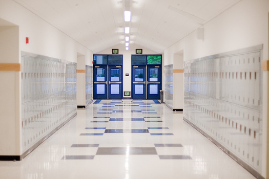 New Hampshire's Lebanon School District, facing pressure to do away with its school resource officer position, has decided to keep it for now while an outside firm studies equity and race issues in the city's schools. (Michael Ireland/Adobe Stock)