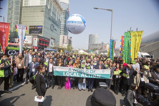Local government representatives marched on World of Action Day at the 2015 World Congress of Local Governments for Sustainability in Seoul, South Korea. Many are headed to Scotland this week.(ICLEI USA)