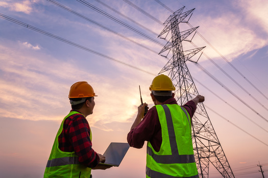 In addition to roads and bridges, labor leaders say the new infrastructure bill approved by Congress allows for work on other needs, such as adding more capacity to electric grids. (Adobe Stock)