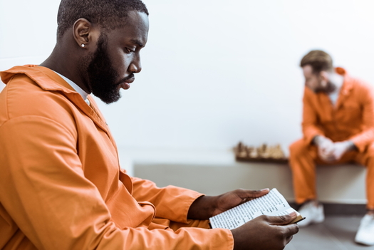 Maryland is one of 12 states where more than half the prison population is African American, according to a new report. (Adobe stock)