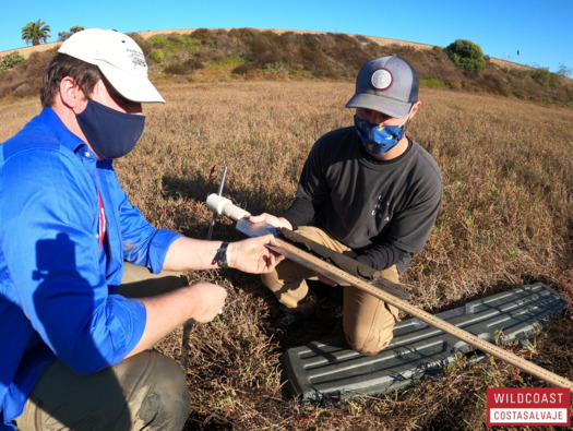 Dr. Matt Costa from Scripps Institution of Oceanography, and intern Austin Lupo with WILDCOAST, collect soil samples at Brigantine Basin in Del Mar, Calif., to measure the stored carbon. (WILDCOAST) 