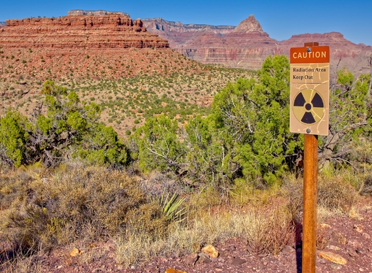 A sign warns of radioactivity near an abandoned uranium mine in the Horseshoe Mesa area near the Grand Canyon. (Deep Desert Photo/Adobe Stock)
