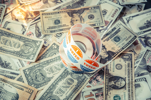 Groups looking to rein in money in politics hope to pass campaign-finance limits before the 2024 election. (Joaquin Corbalan/Adobe Stock)
