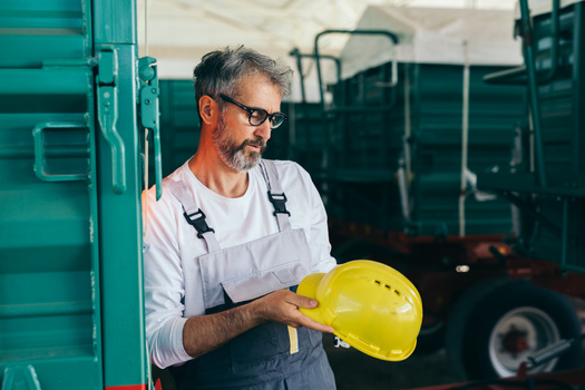 Farm safety experts say such factors as a wet harvest season can lead to more accidents in places like grain bins, as the product can clog up equipment, putting workers in dangerous positions. (Adobe Stock)