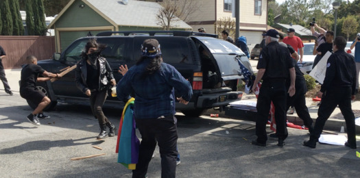 Counterprotesters attack a car at a Ku Klux Klan rally in Anaheim in February 2016. (Brian Levin)