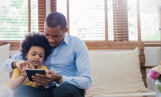 Researchers say parents should set a good example for their kids when it comes to screen time using digital devices. (paulaphoto/Adobe Stock)