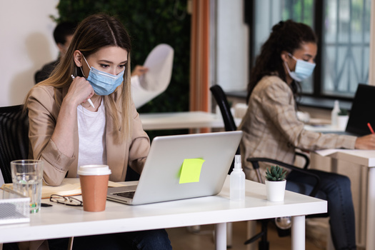 The Centers for Disease Control and Prevention recommends employees wear face masks to help prevent the spread of COVID-19. (Adobe Stock)