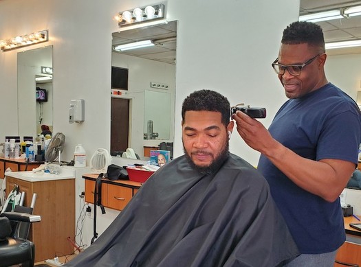 Greensboro barber Anthony Pettiford doesn't shy away from health conversations while cutting clients' hair. (Sarah Fedele/American Heart Association of North Carolina)