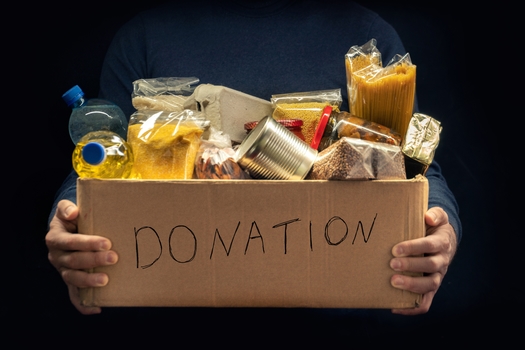 Since the National Association of Letter Carriers began participating in the annual Stamp Out Hunger Food Drive, they have collected an estimated 1.8 billion pounds of food for families in need. (Andrii/Adobe stock)