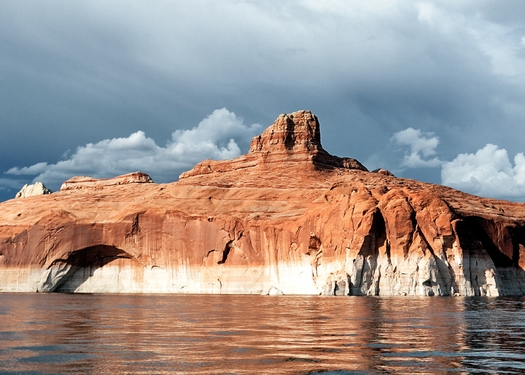 White cliffs along the shore of Lake Powell show how much lower levels in the lake have become over the past decade. (Prochasson/Adobe Stock)