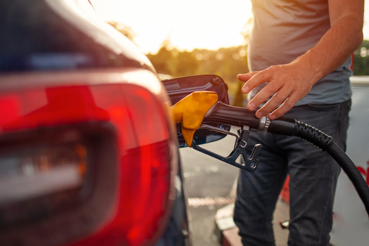 The spike in gas prices means many people are likely to modify their summer vacations this year. (Dragana Gordic/Adobe Stock)