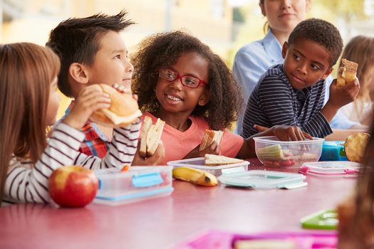 Omaha Public Schools reported that being able to offer meals to all students at no charge reduced childhood hunger, supported academic achievement, eliminated stigma associated with school meals and improved student behavior. (Adobe Stock)