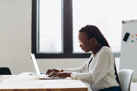 Research suggests Black women are more often targeted by corporate grooming policies. (Adobe Stock)